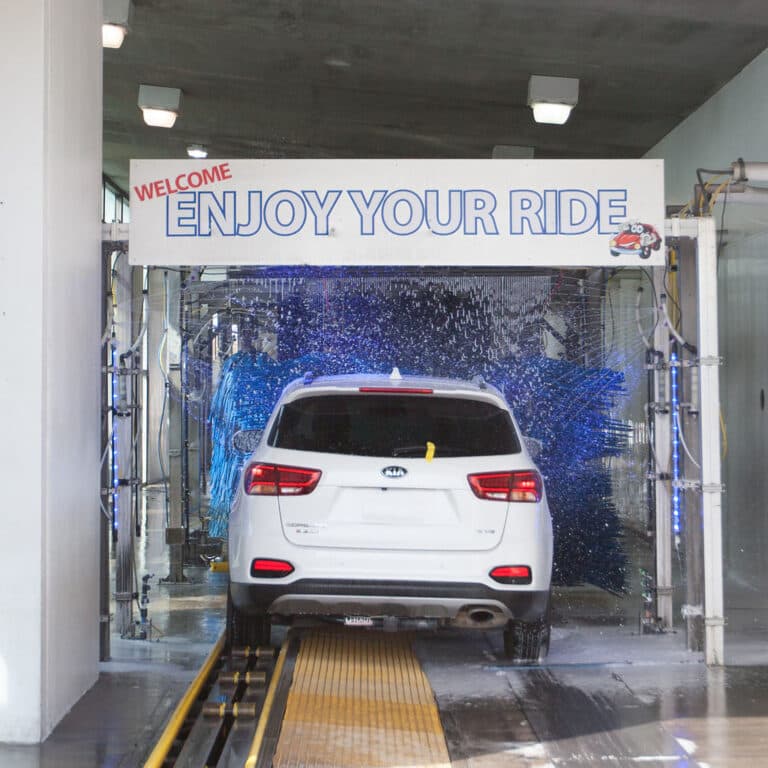 A car rolling into the soft-cloth tunnel at Don's